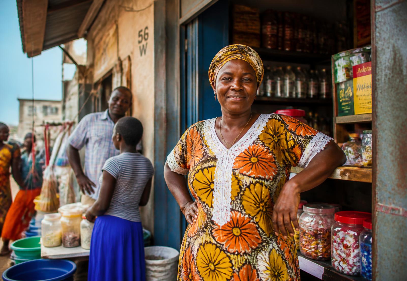 Small business owner at her shop counter in a Tanzanian market